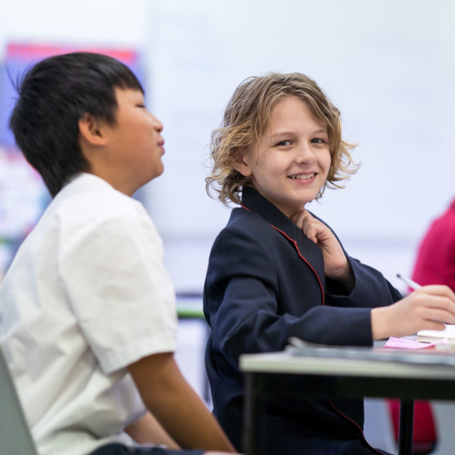 Smiling male junior school student