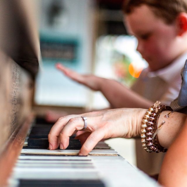 Young boy receives private piano tuition